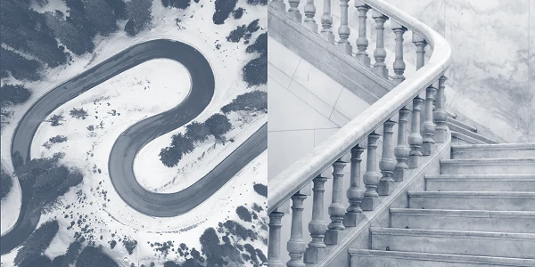 Eine Ansicht zeigt eine kurvenreiche Straße in einer verschneiten Landschaft auf der linken Seite und eine elegante Treppe mit gesprungenen Balustraden aus Marmor auf der rechten Seite.